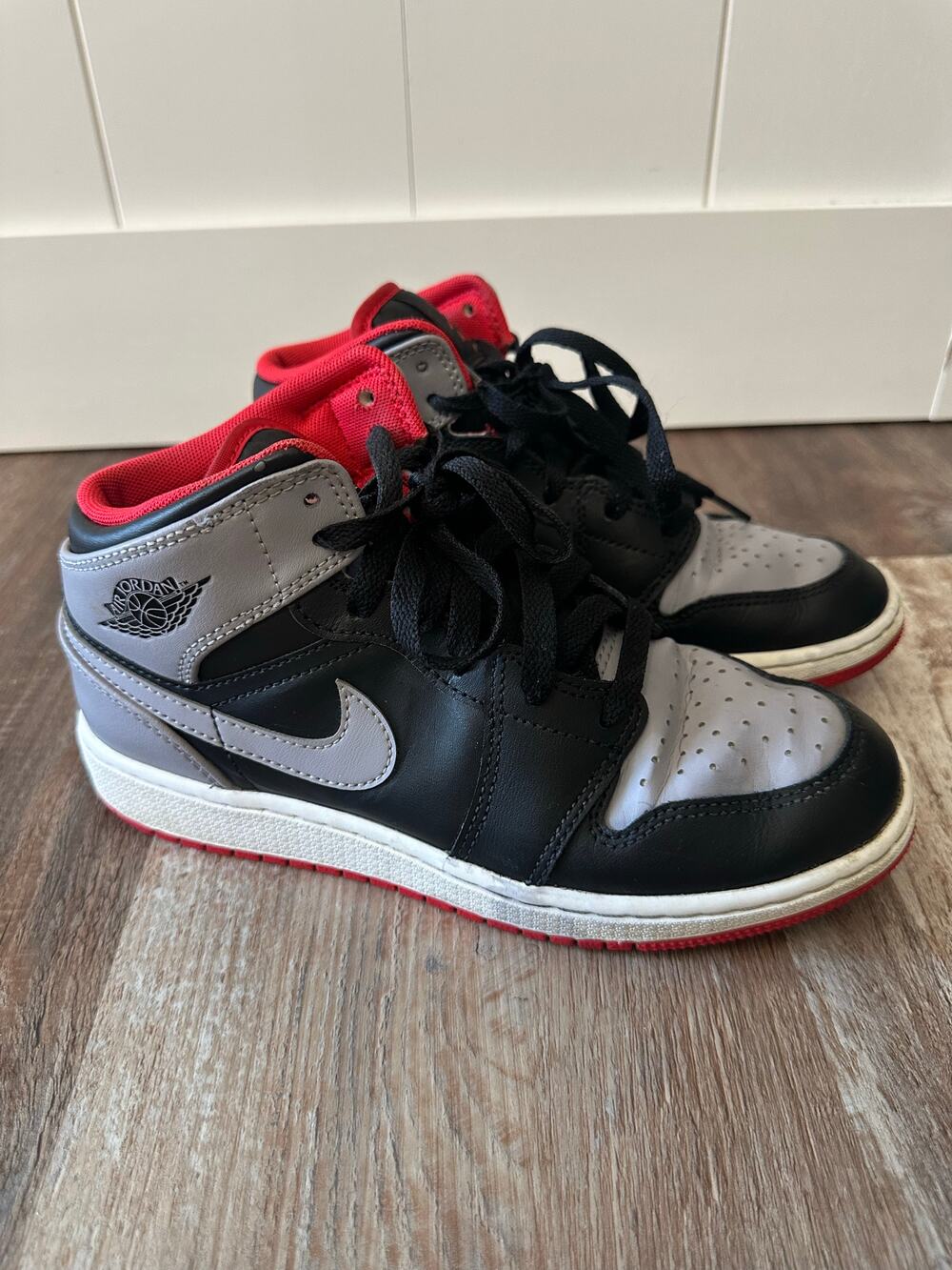 Jordan 1’s in gray, black, red size Youth 4.5